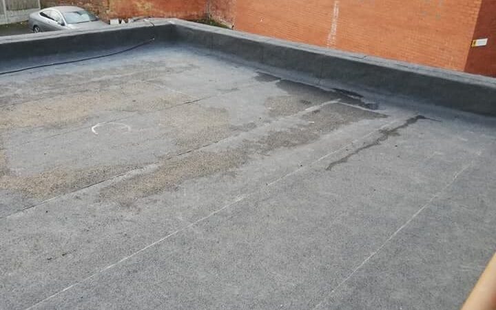 an old flat roof in need of replacing