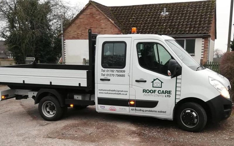 White van in front of a house with a brown roof, showcasing Roofcare North Staffs branding